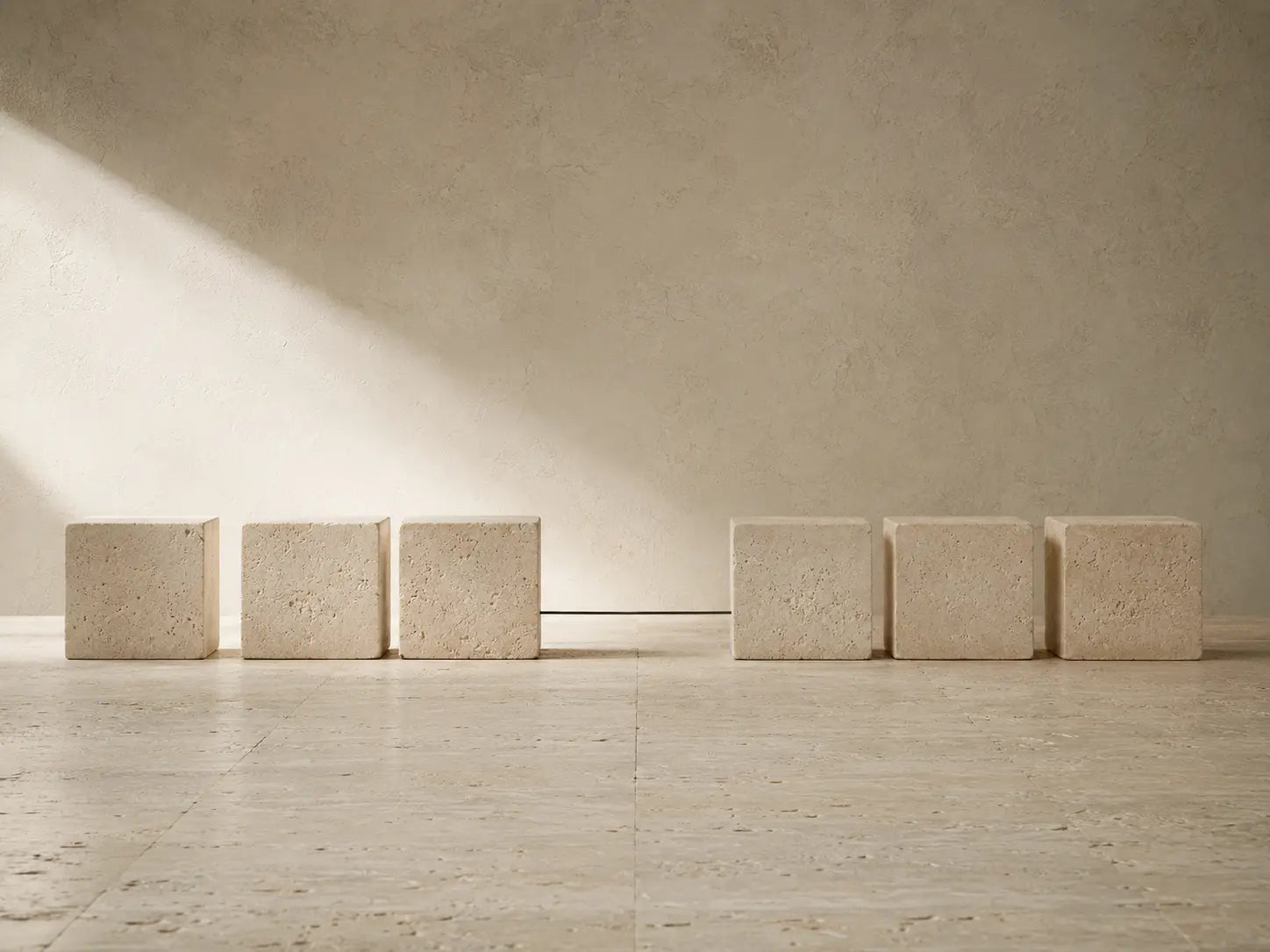 Limestone blocks separated by a deliberate gap, representing a break in consistency