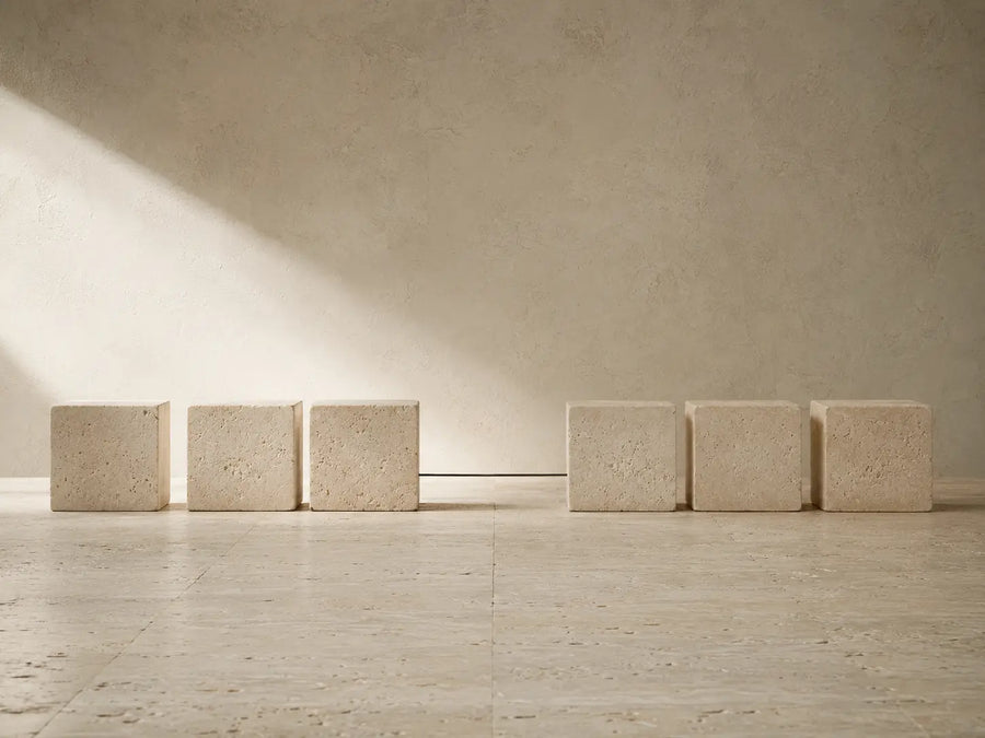 Limestone blocks separated by a deliberate gap, representing a break in consistency