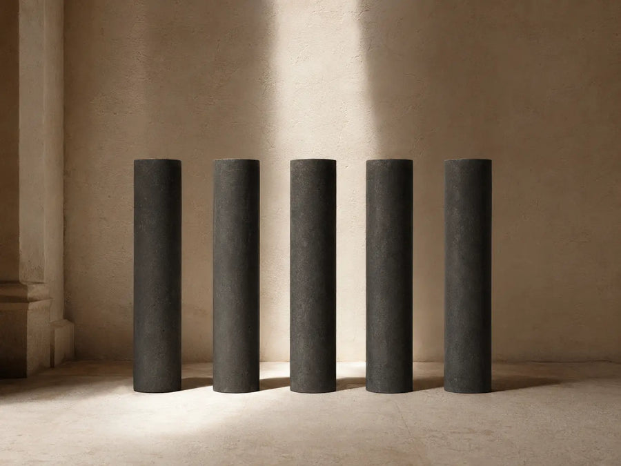Five aligned charcoal pillars representing discipline and consistent standards