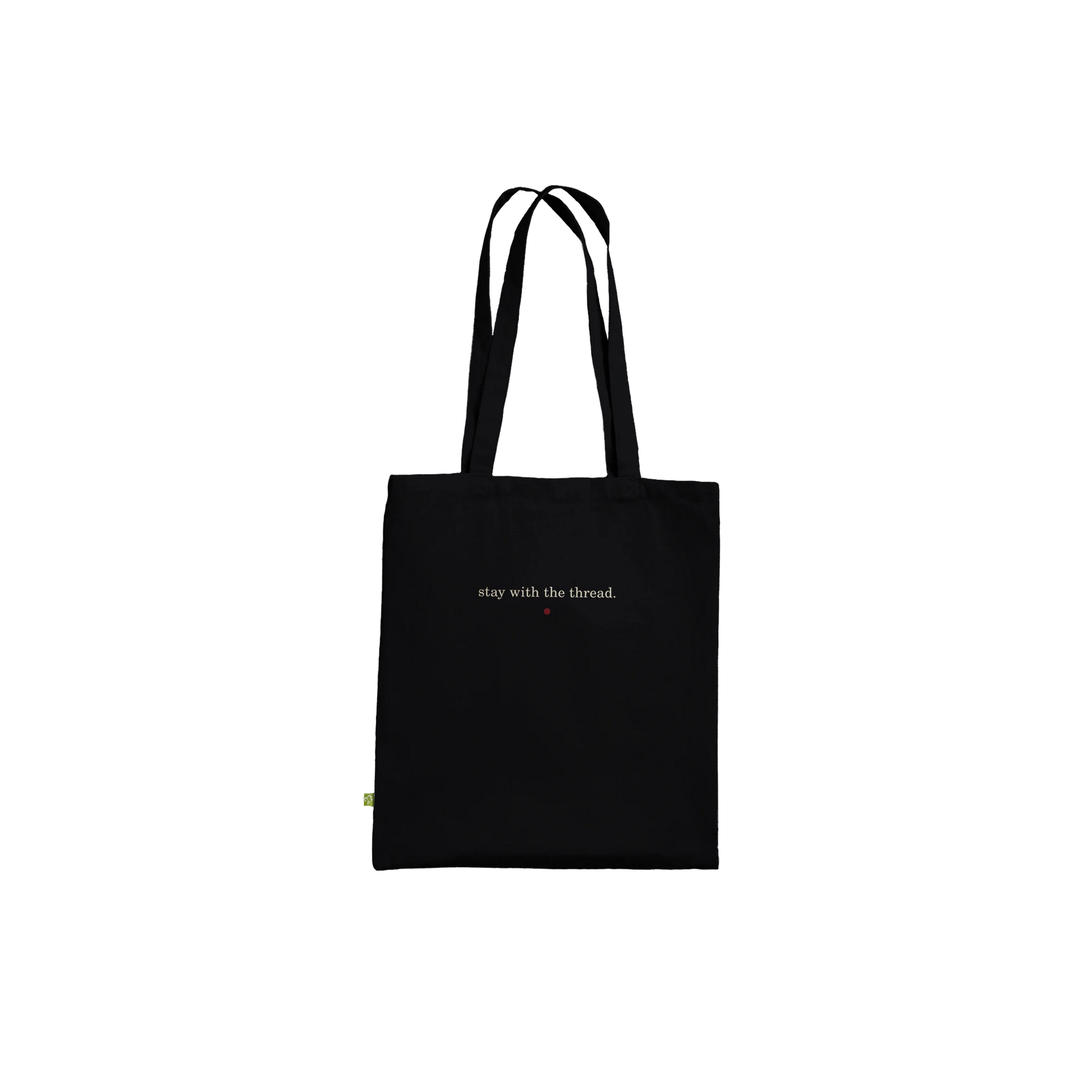 Back view of THE THREAD black tote showing the small reverse affirmation.