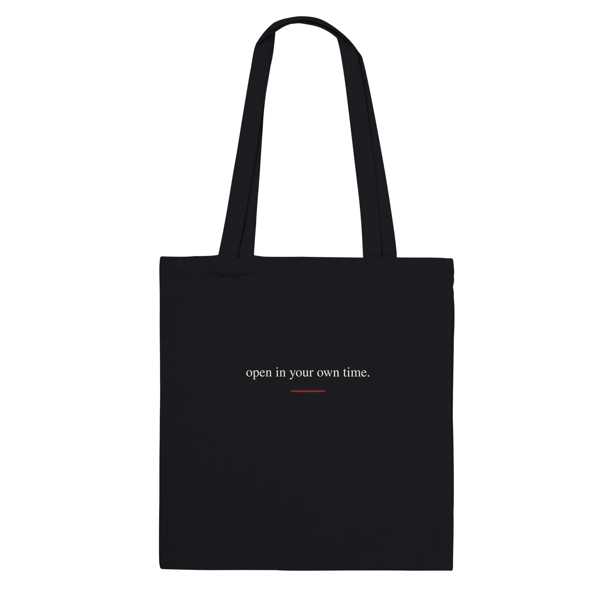 Back view of THE BLOOM black tote bag with warm-ivory serif affirmation