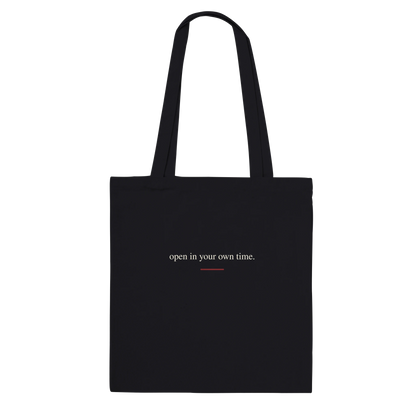 Back view of THE BLOOM black tote bag with warm-ivory serif affirmation