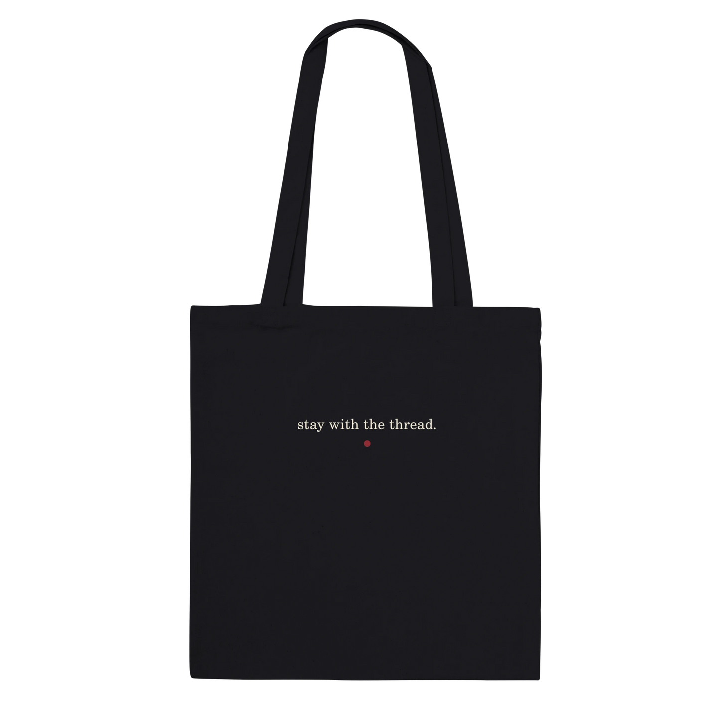 Back of THE THREAD tote featuring the words stay with the thread in ivory lettering.