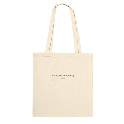 Back of THE VESSEL natural cotton tote featuring “make room for meaning.” in small aubergine serif lettering.