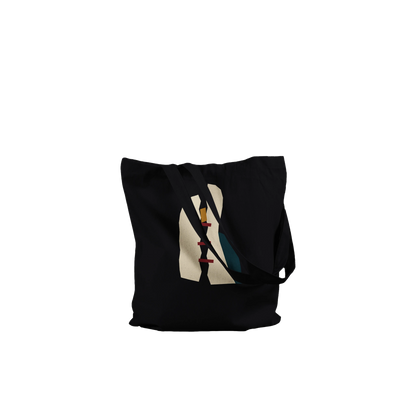 Folded THE MENDING black cotton tote showing its fractured ivory, oxblood, petrol and ochre abstract artwork.