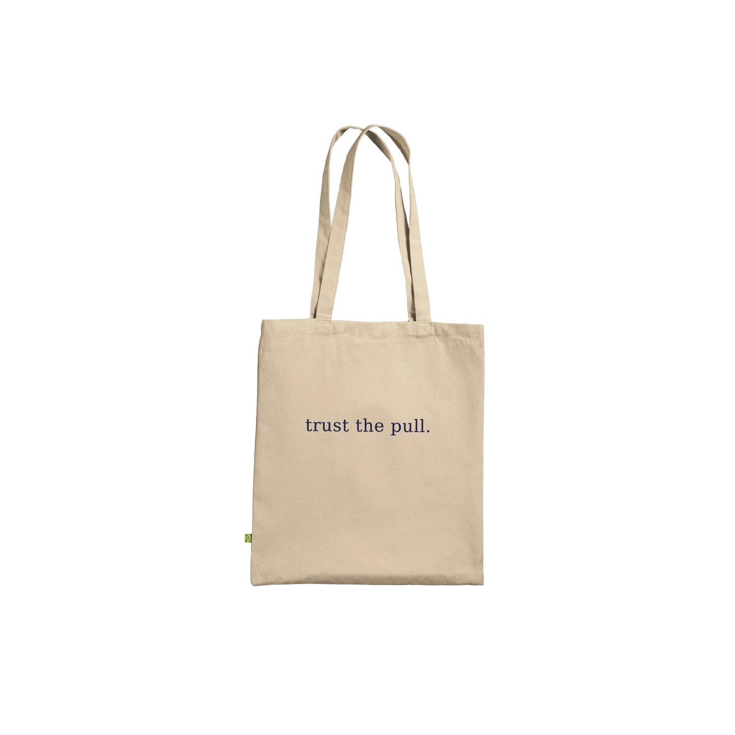 Back of THE PULL tote featuring the affirmation trust the pull in small navy serif lettering.