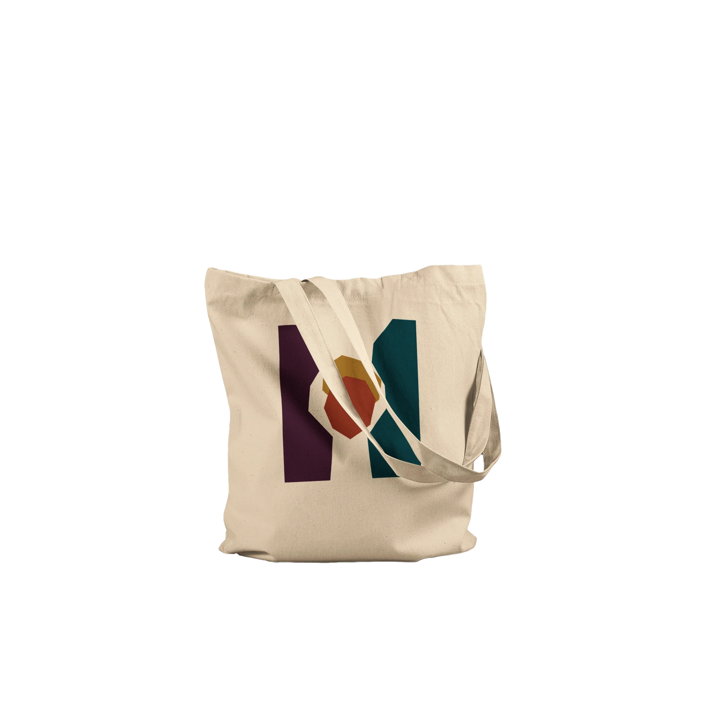Folded THE KEEPING cotton tote showing the aubergine, petrol and sienna abstract design