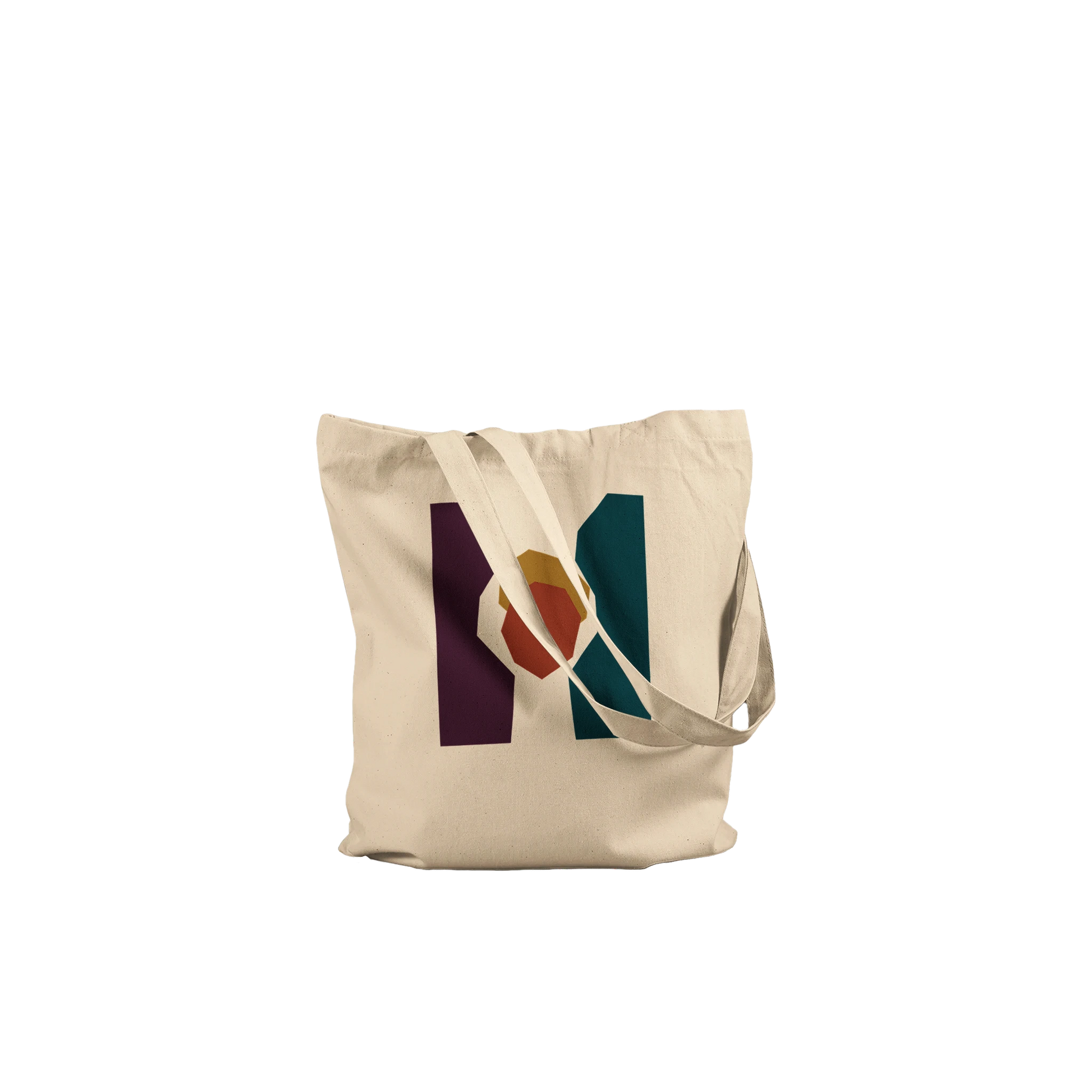 Folded THE KEEPING cotton tote showing the aubergine, petrol and sienna abstract design