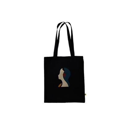 Front view of THE LISTENING black cotton tote featuring the ivory and petrol-blue sculptural profile.