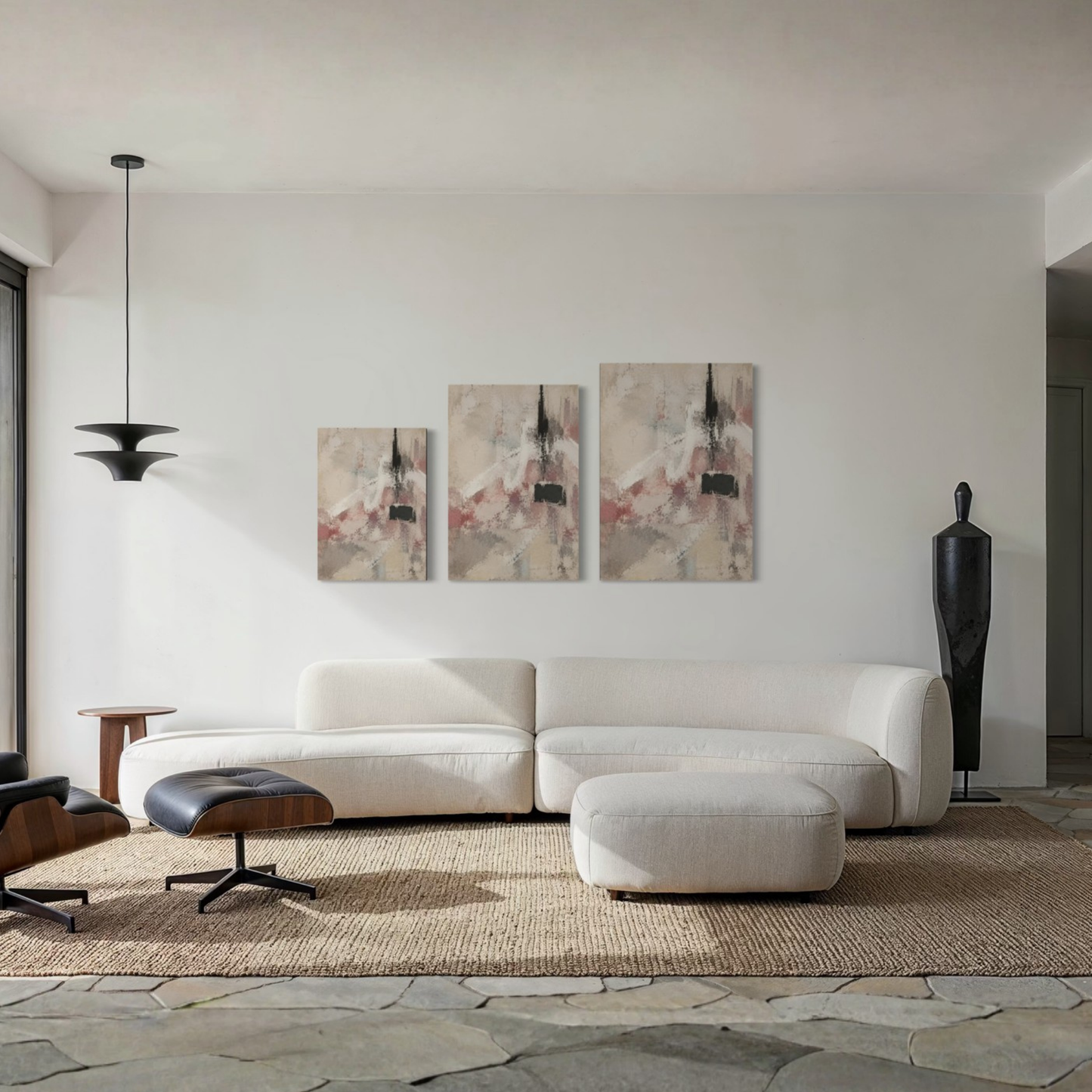 The Unsaid neutral canvas art displayed above a curved cream sofa in a refined contemporary living room.