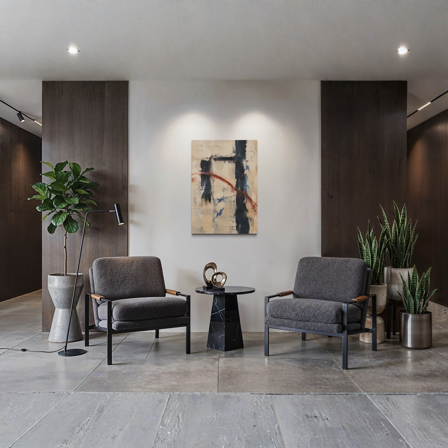 Boundary abstract canvas art displayed between two dark armchairs in a refined modern interior with dark wood panels and greenery.
