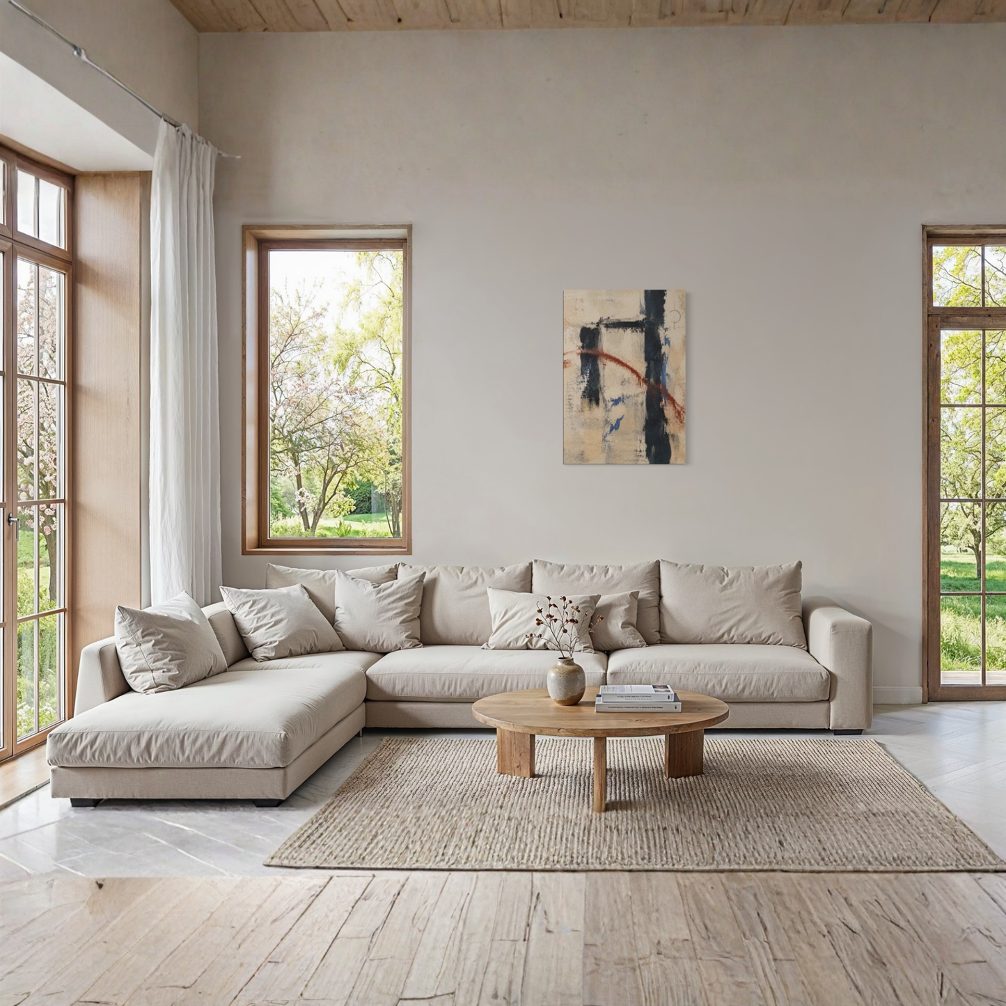 Boundary neutral abstract canvas styled above a pale sofa in a light modern interior.