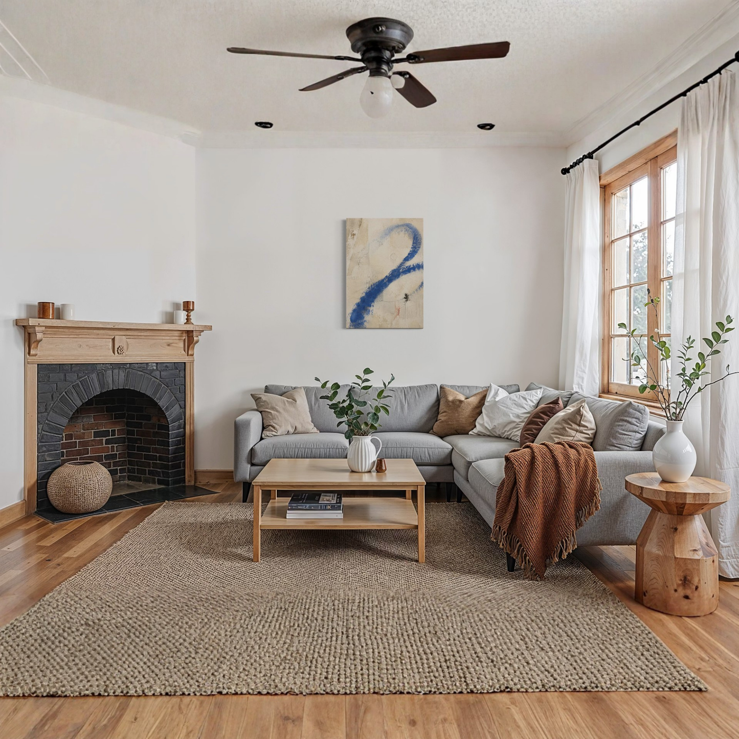 Proof of Life abstract wall art displayed in a warm contemporary living room with fireplace and natural wood flooring.