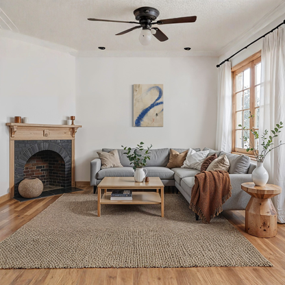 Proof of Life abstract wall art displayed in a warm contemporary living room with fireplace and natural wood flooring.