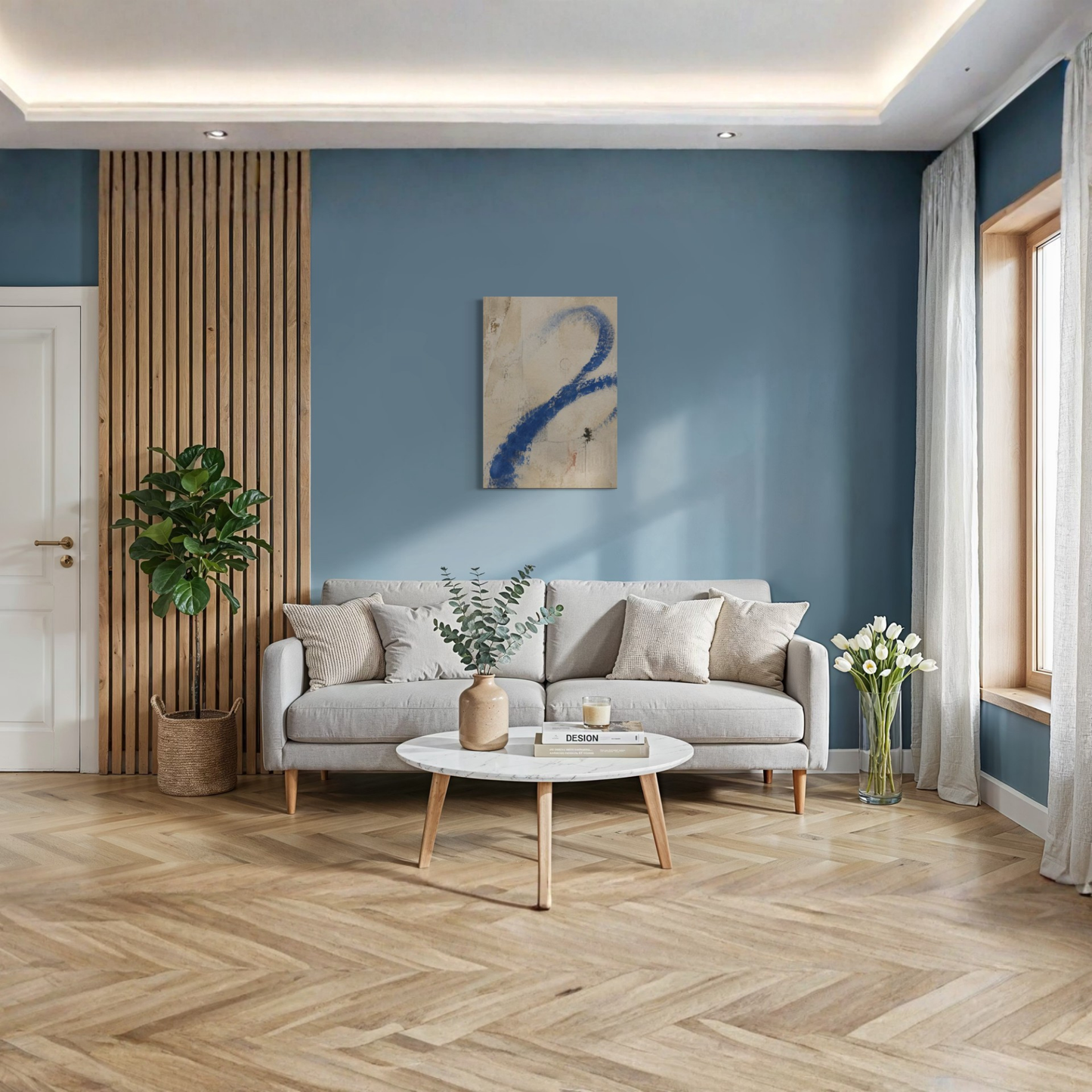 Proof of Life cobalt blue canvas art displayed above a cream sofa against a muted blue wall.