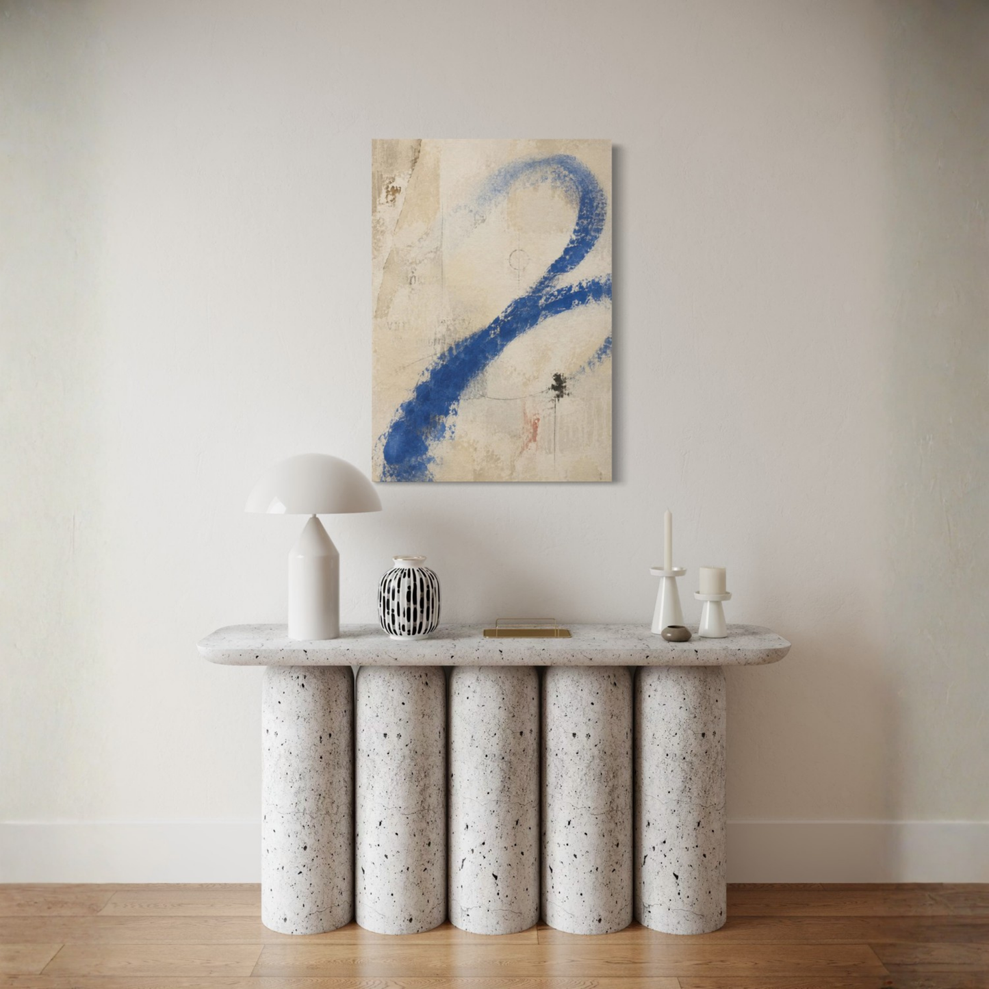 Proof of Life abstract canvas styled above a sculptural cream console in a restrained neutral interior.
