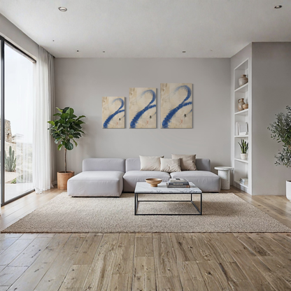 Proof of Life blue abstract canvas displayed above a neutral sofa in a bright contemporary living room.