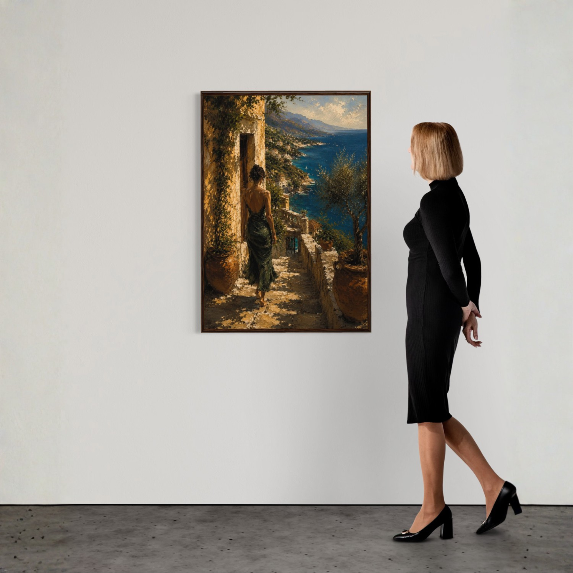 Woman in a black dress standing next to a painting of a coastal scene.