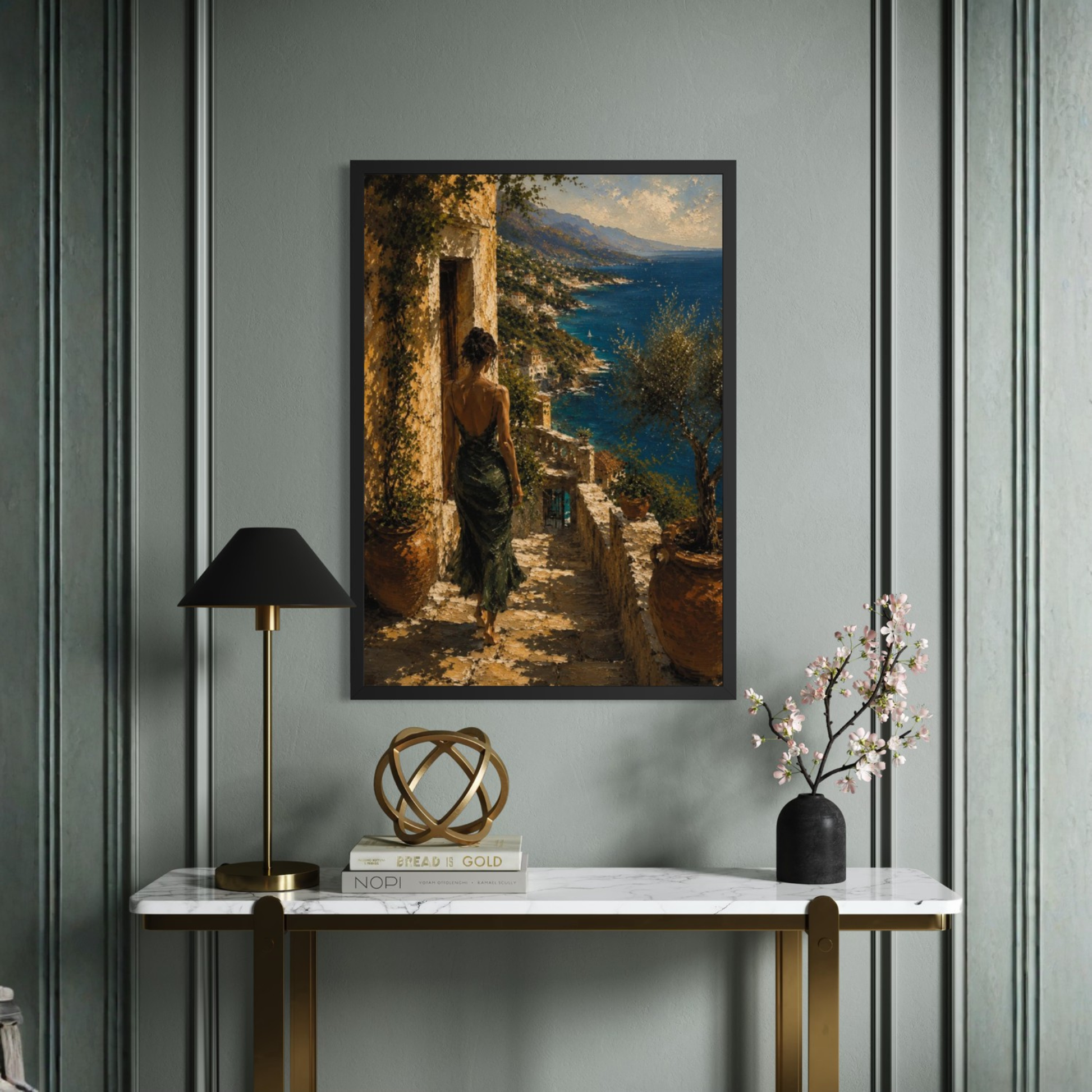 Mediterranean framed art of a woman walking along a path by the sea on a wall with decorative elements below.