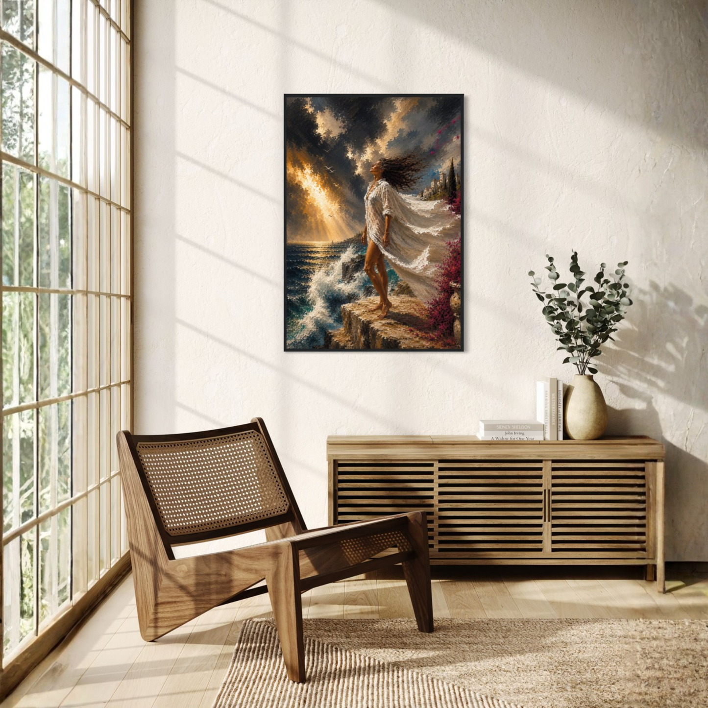 The Clearing Mediterranean storm art displayed in a black wood frame displayed on a textured white wall in a modern, sunlit room with a wooden chair and console table.