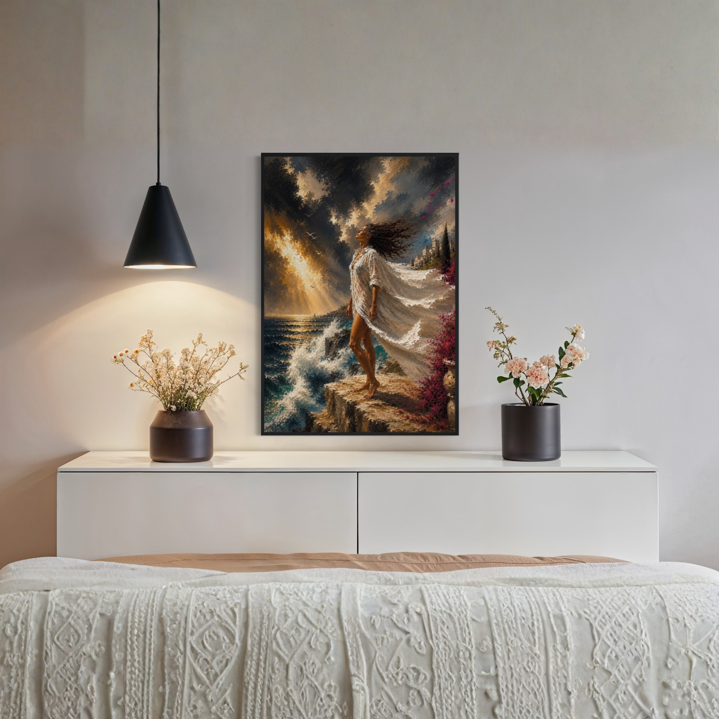 The Clearing Mediterranean storm art displayed in a black wood frame displayed on a white console above a bed in a styled bedroom setting.