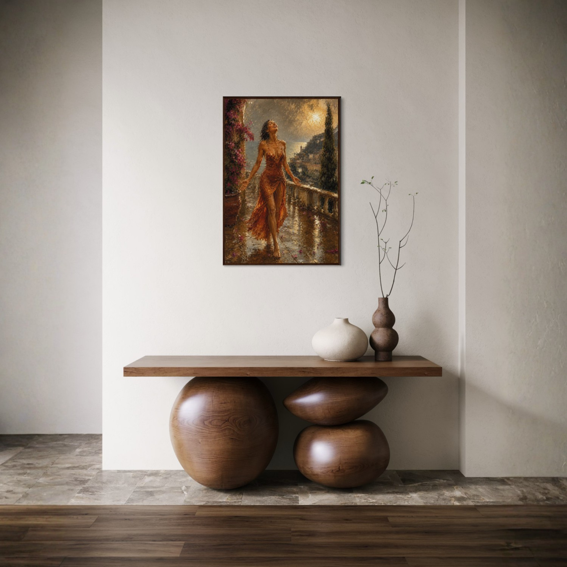The Sunshower Mediterranean framed art print in a dark wood frame displayed on a wall above a wooden console table with decorative vases in a modern minimalist interior.
