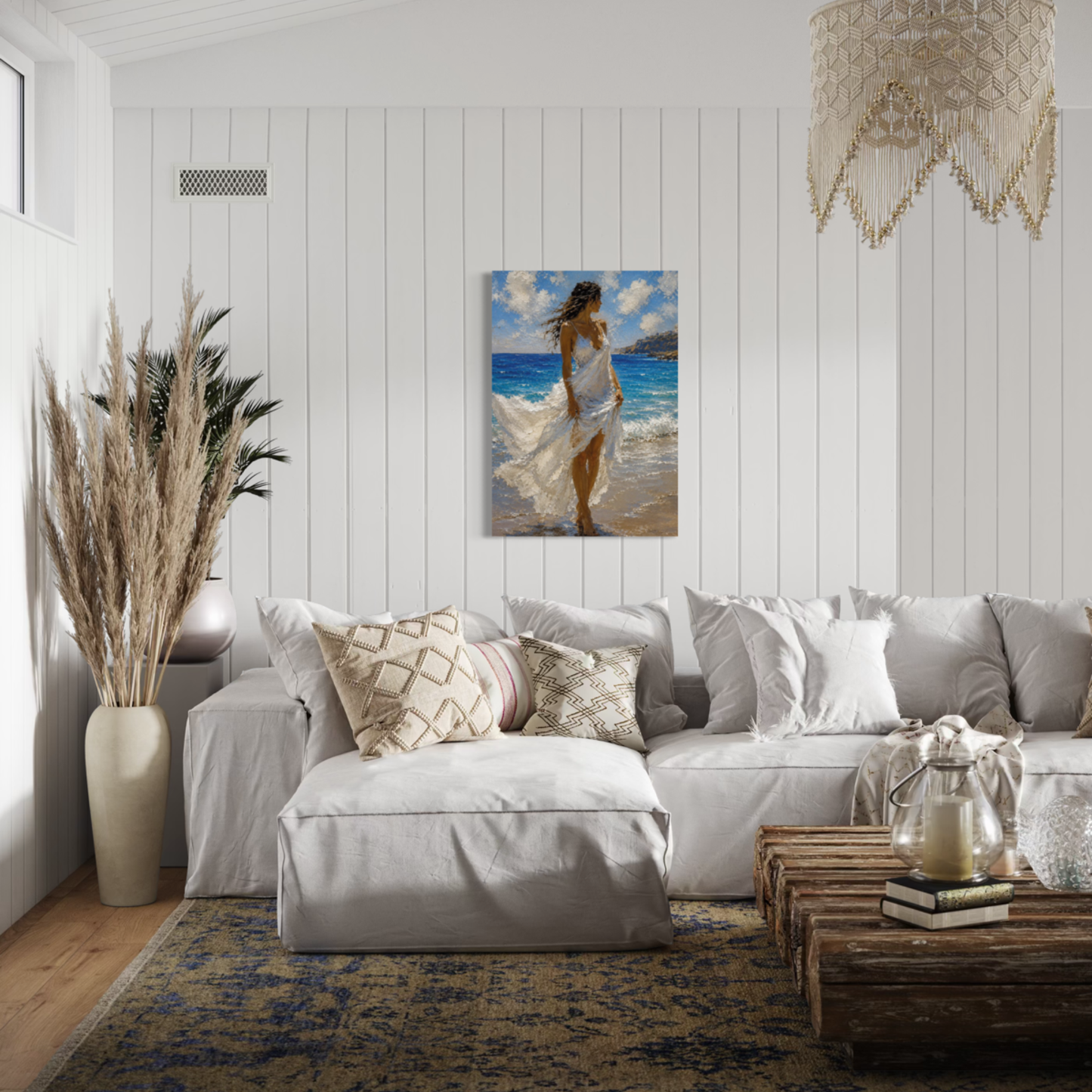 Windswept Mediterranean canvas art displayed on a white paneled wall above a modern light gray sectional sofa in a styled living room.