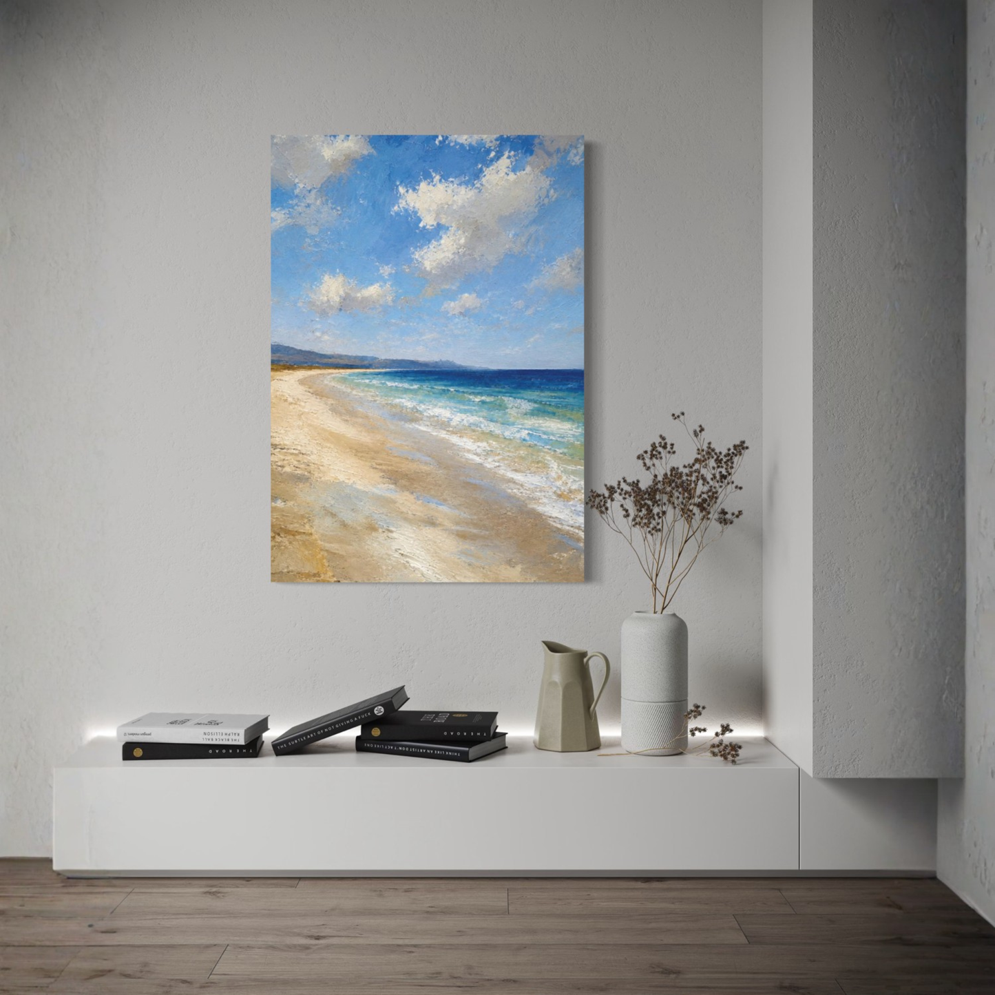 The Blue Distance Mediterranean canvas art displayed on a light gray wall above a white console table with books and a vase.