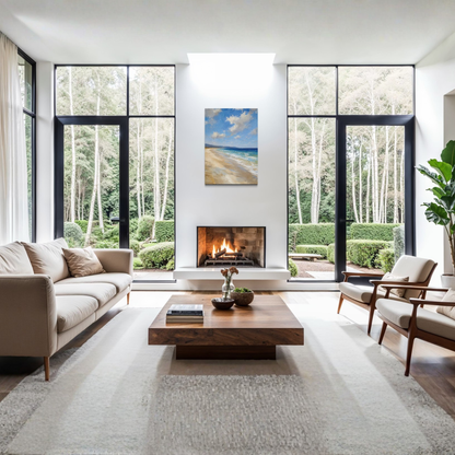 A modern living room with a beige sofa, wooden coffee table, and two mid-century style armchairs, set in a bright room with large black-framed windows overlooking a forest. A small fireplace is centered on the white wall, with The Blue Distance Mediterranean canvas art above it.