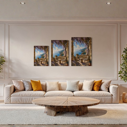 A staged living room with a cream sofa, round wooden coffee table, and three Terrace Mediterranean canvas arts mounted on the wall above the couch.
