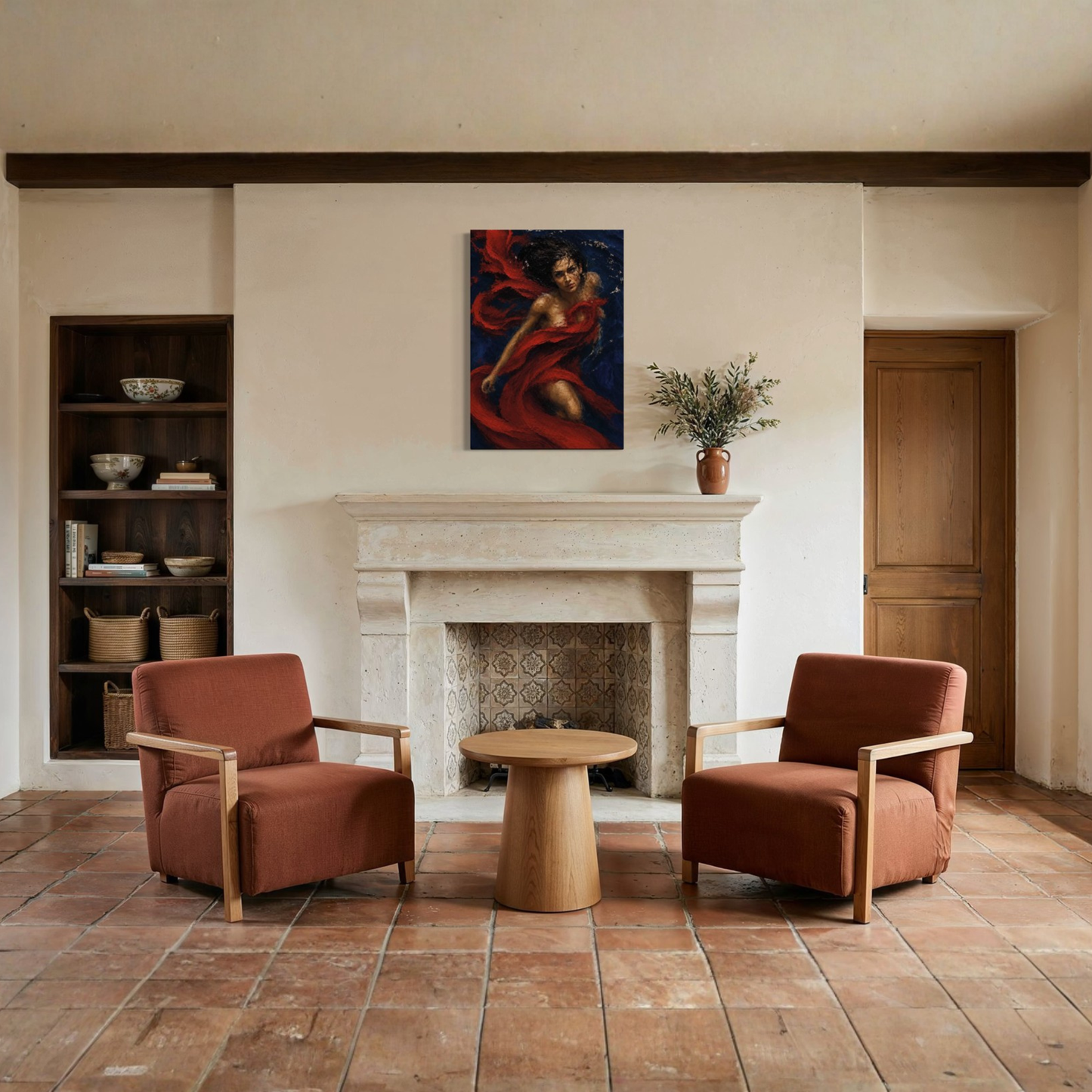 A styled interior room with two rust-brown armchairs facing a small round wooden side table, set in front of a white stone fireplace. The Crimson Undertow gallery-wrapped canvas hangs above the fireplace, and a shelf with books and a potted plant sit on either side.