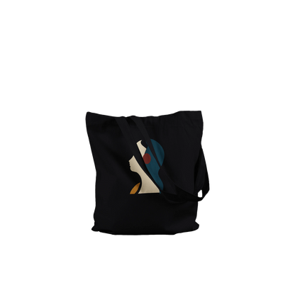 Folded THE LISTENING black cotton tote showing the sculptural profile artwork and substantial fabric texture.
