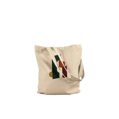 Folded THE THRESHOLD natural cotton tote showing its forest-green, rust and burgundy abstract artwork.
