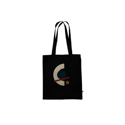 Front view of THE ALIGNMENT black cotton tote with an ivory arc, petrol circle, oxblood axis and ochre disc.